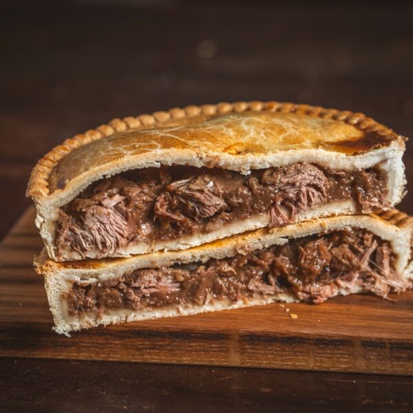 Large steak pie cut in half
